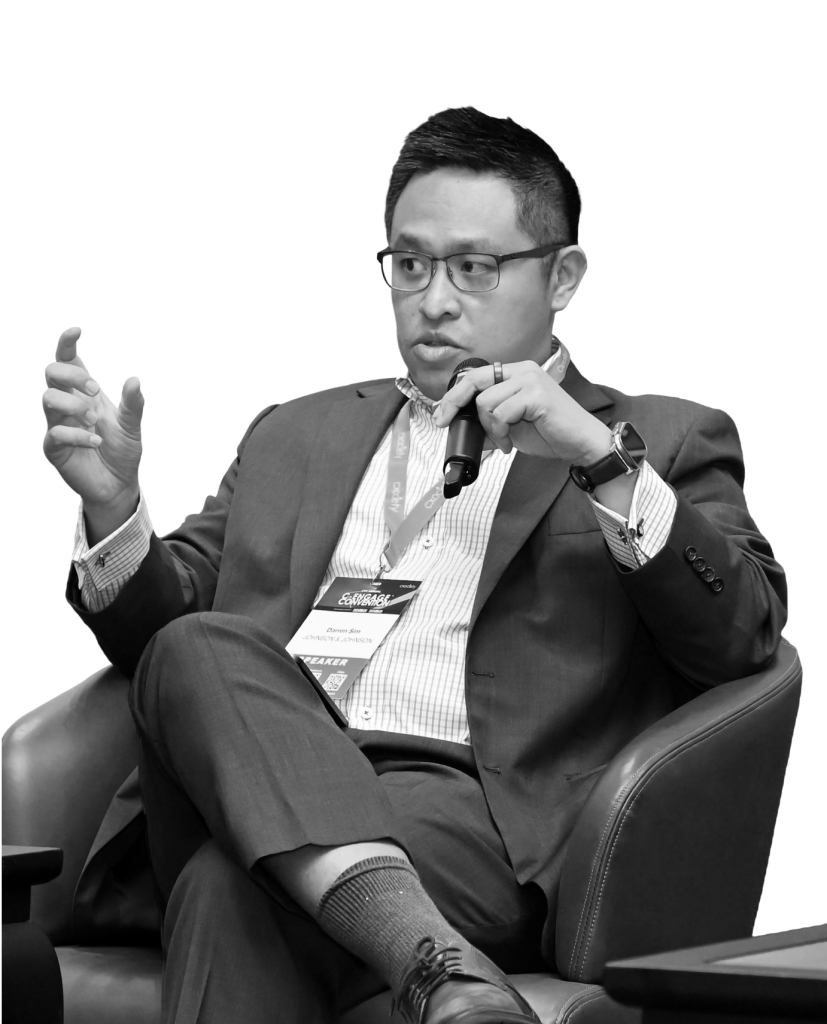 Darren Sim speaking at a conference